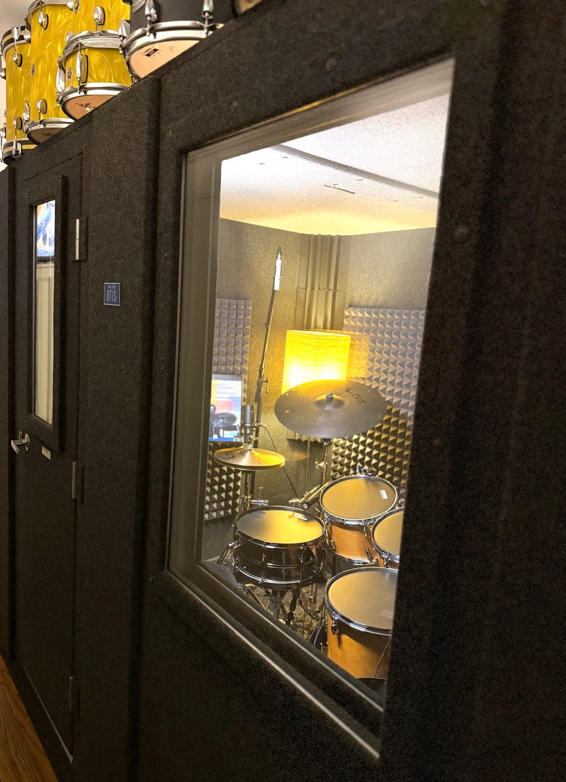 The Whisper Box and drum kit in a New York apartment